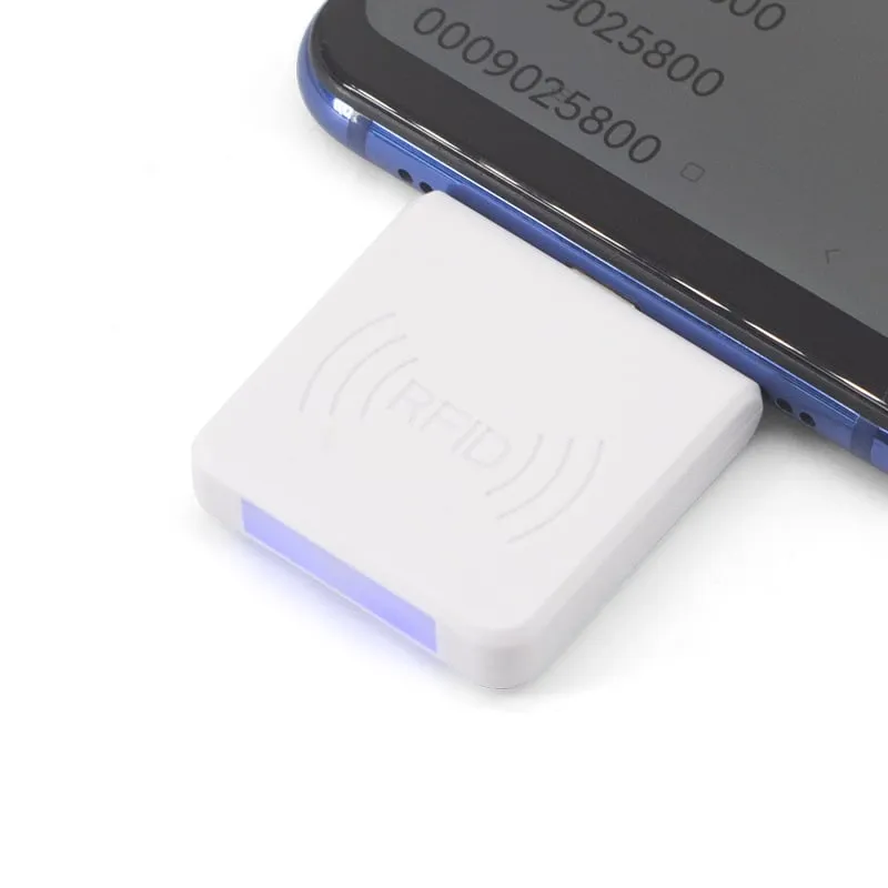 A220-C white USB-C reader plugged into an Android phone, status light on and tag number on screen