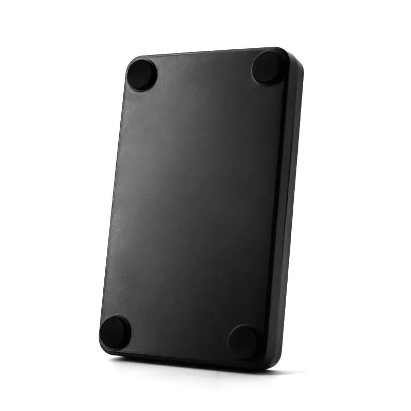 U140-U compact black UHF RFID desktop reader/writer, underside with four rubber feet